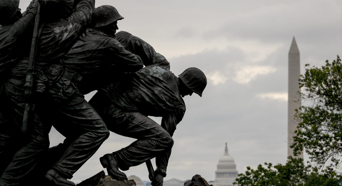 The Washington Monument and the dome of the U.S. Capitol Building are visible behind the U.S. Marine Corps War Memorial in Arlington, Va., on Memorial Day. CREDIT: Andrew Harnik/AP