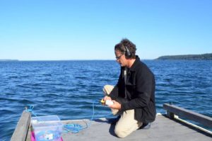 Oceanographer Scott Veirs sets up a hydrophone to listen to ships and orcas at Bush Point, Whidbey Island, in 2018.