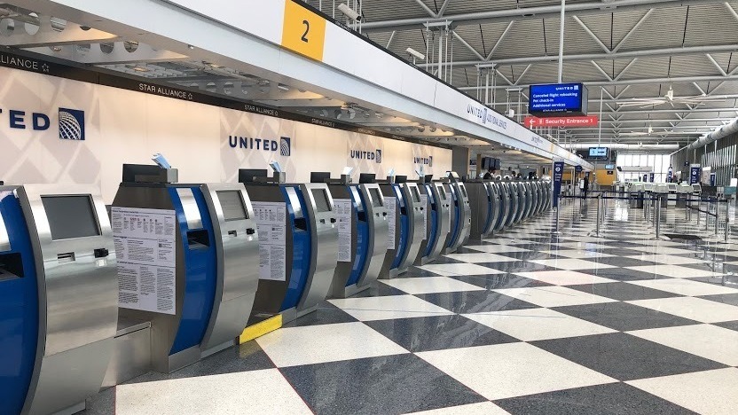 An empty terminal at Chicago's O'Hare International Airport. The normally bustling check-in at the United Airlines terminal was eerily quiet on April 24. CREDIT: David Schaper/NPR