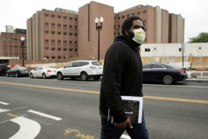 Dontaine Thompson walks to meet his ride after being released from the District of Columbia Central Detention Facility, where he said he tested positive for the coronavirus on April 9 and was released from jail early, due to concerns during the COVID-19 outbreak in Washington.