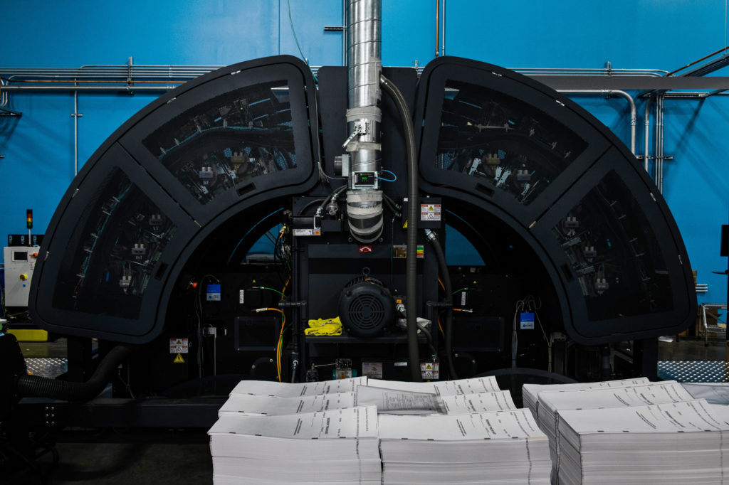 Runbeck Election Services uses these massive HP inkjet web printers to make mail-in ballots. CREDIT: Ash Ponders for NPR