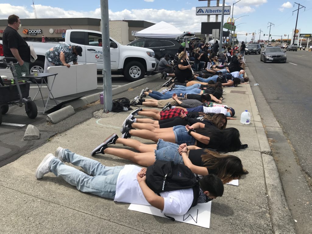 Protesters in Pasco lay on the sidewalk for 8 minutes and 46 seconds, the amount of time a Minneapolis police officer pressed his knee into George Floyd’s neck. CREDIT: Courtney Flatt/NWPB
