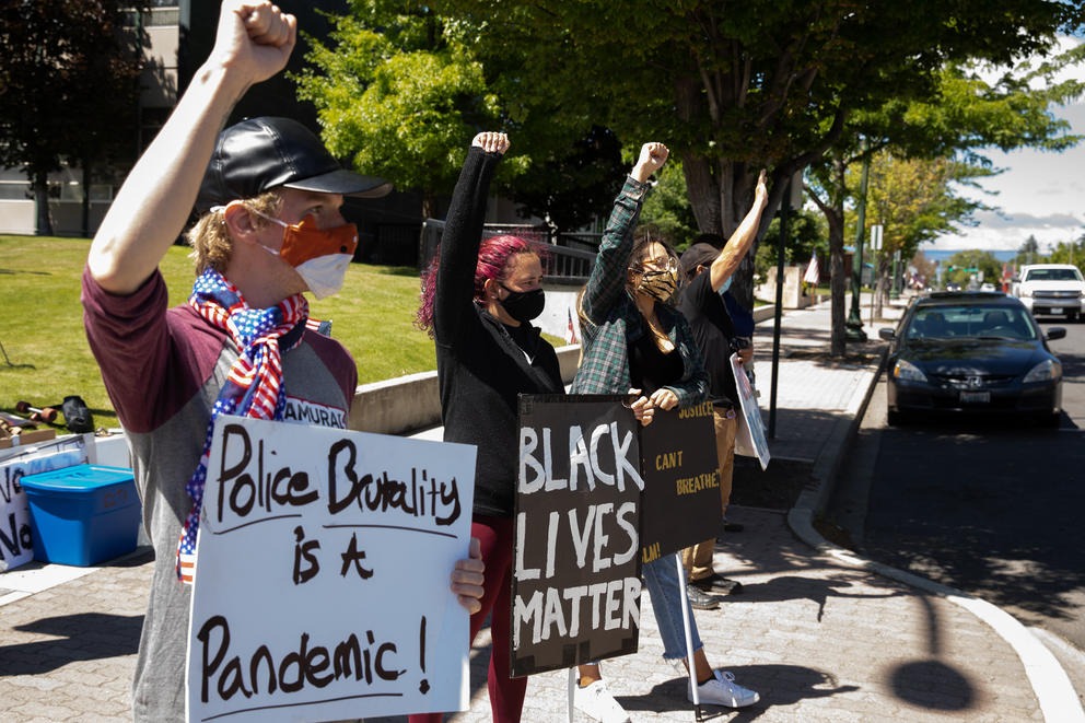 A small group of Black Lives Matter protesters gathers at the corner of North Main Street and West Fifth Avenue in Ellensburg on June 14, 2020. (Matt M. McKnight/Crosscut)