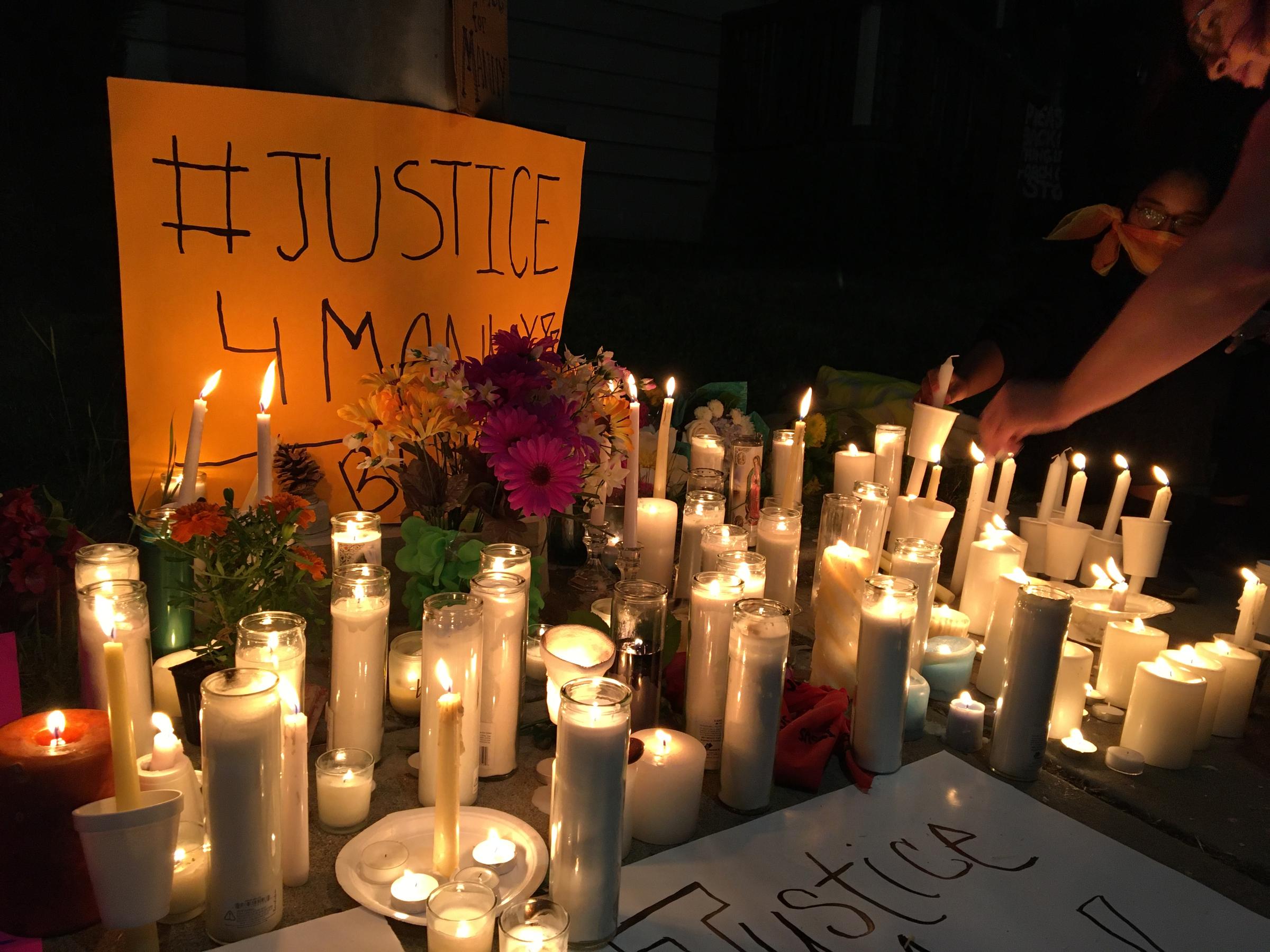 Hundreds gathered at a vigil Wednesday night to remember Manuel Ellis, who died March 3 in the custody of Tacoma police officers. His death has been ruled a homicide by the Pierce County medical examiner, and the officers have been placed on leave. CREDIT: Will James/KNKX