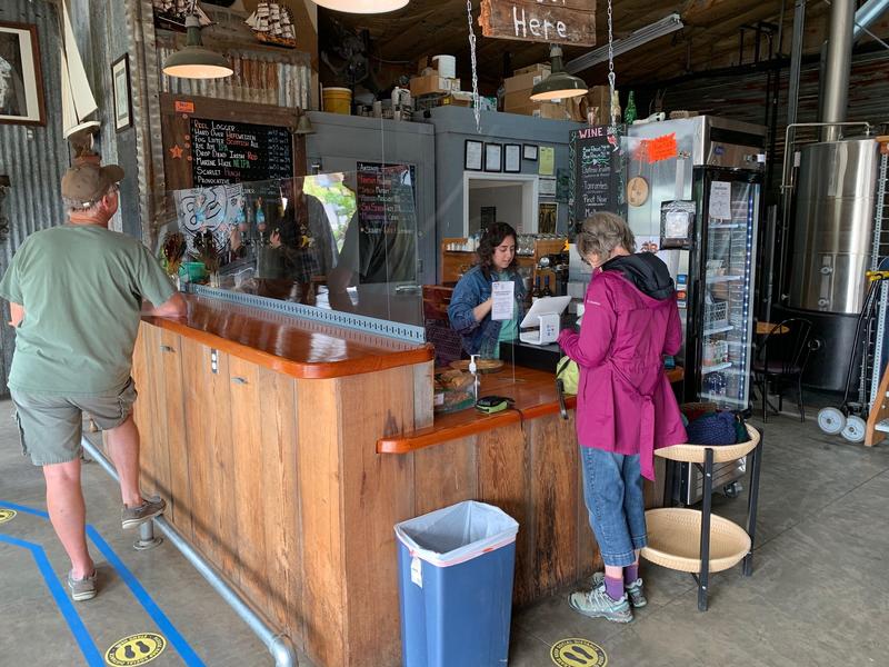 File photo. Customers flocked to the River Mile 38 brewpub in Cathlamet after it reopened its tasting room and patio in mid-May. Wahkiakum County is in the vanguard of Washington counties advancing through Safe Start reopening phases. CREDIT: Tom Banse/N3
