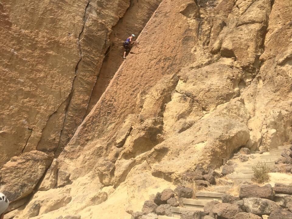 Reporter Courtney Flatt climbs on a guided trip at Smith Rock State Park in Central Oregon, one of the most popular and expansive rock climbing spots in the Northwest. CREDIT: Sara Schilling