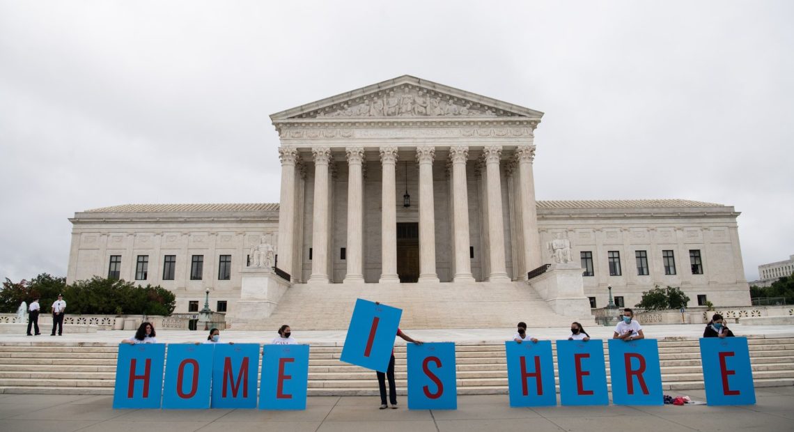 Activists hold a banner in front of the Supreme Court in Washington, D.C., on Thursday as the court rejected the Trump administration's move to rescind the Deferred Action for Childhood Arrivals program. Nicholas Kamm/AFP via Getty Images