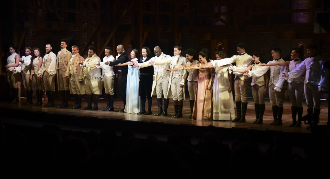 The cast of Hamilton, including its composer and creator, Lin-Manuel Miranda, center, receive a standing ovation in San Juan, Puerto Rico on Jan. 11, 2019. The musical is set to stream on Disney+ this week. CREDIT: Carlos Giusti/AP