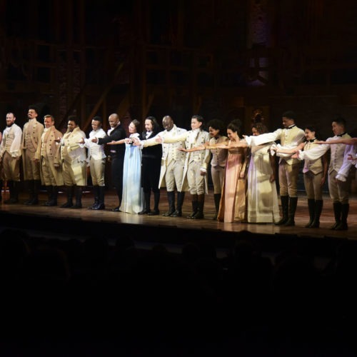 The cast of Hamilton, including its composer and creator, Lin-Manuel Miranda, center, receive a standing ovation in San Juan, Puerto Rico on Jan. 11, 2019. The musical is set to stream on Disney+ this week. CREDIT: Carlos Giusti/AP