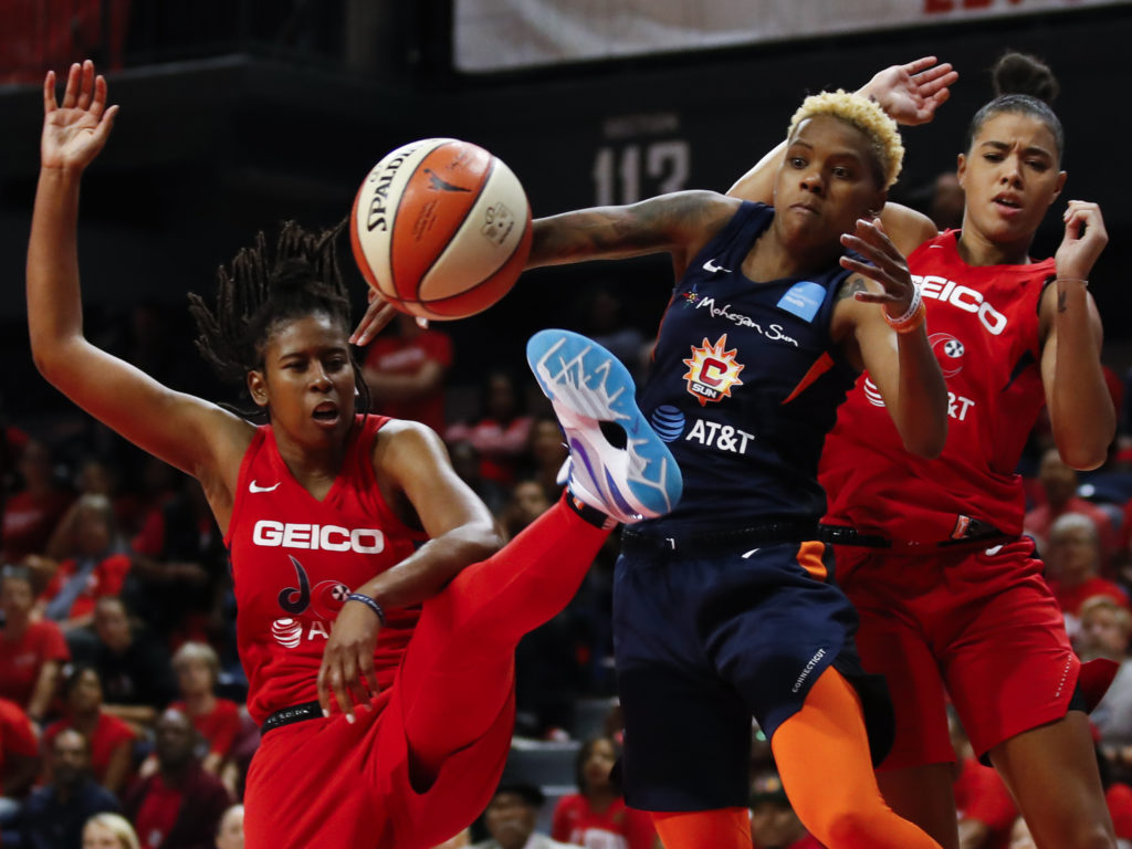 The Washington Mystics play in Game 5 of basketball's WNBA Finals in October. The league, which postponed the start of its season due to the coronavirus, announced plans to reopen in July. CREDIT: Alex Brandon/AP
