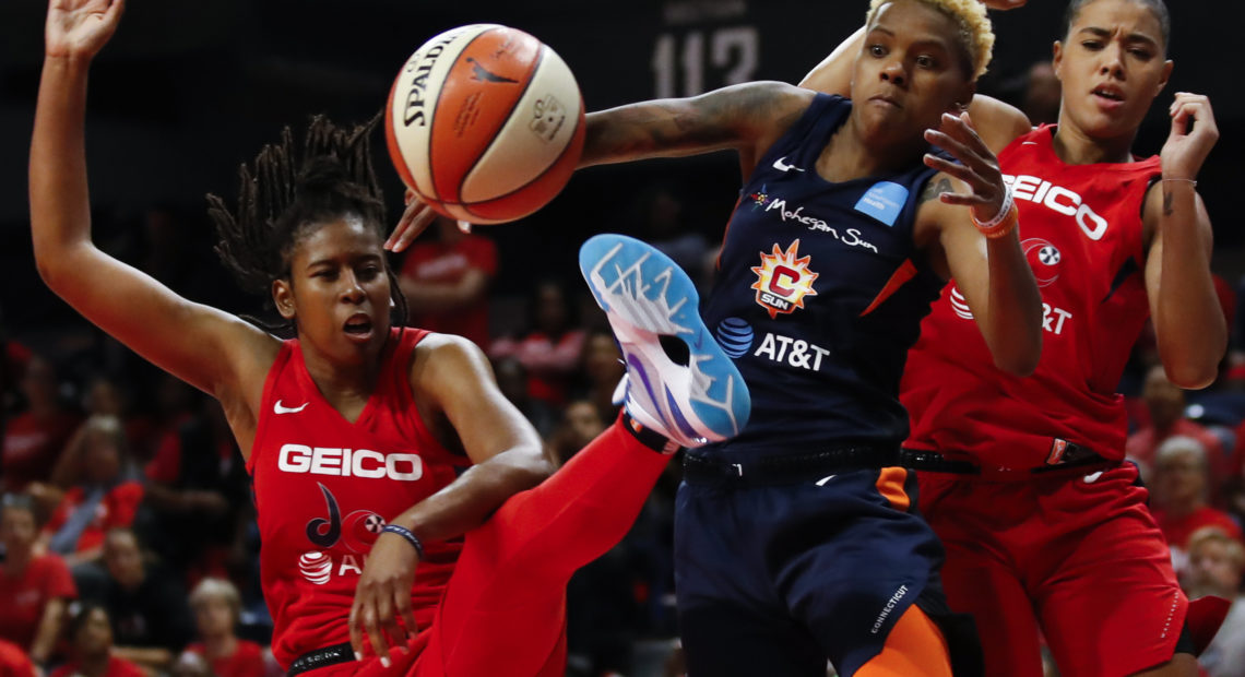 The Washington Mystics play in Game 5 of basketball's WNBA Finals in October. The league, which postponed the start of its season due to the coronavirus, announced plans to reopen in July. CREDIT: Alex Brandon/AP