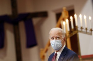 Former Vice President Joe Biden listens Monday as clergy members and community activists speak during a visit to Bethel AME Church in Wilmington, Del.