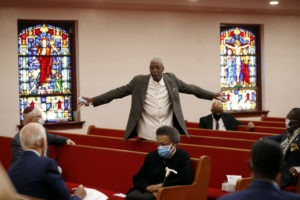 Bishop Thomas Wesley Weeks speaks to Biden on Monday at Bethel AME Church in Wilmington. 