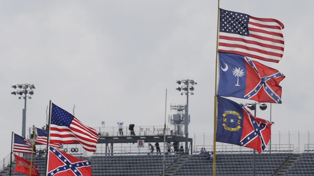 Confederate-themed flags fly in the infield before a NASCAR race at Darlington Raceway in South Carolina in 2015. Terry Renna/AP