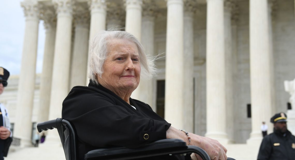 Transgender activist Aimee Stephens sits in her wheelchair outside the Supreme Court on Oct. 8, 2019, as the court holds oral arguments in cases dealing with workplace discrimination based on sexual orientation. CREDIT: Saul Loeb/AFP via Getty Images