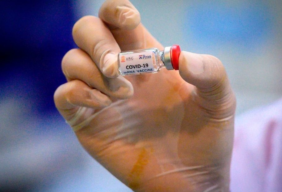A laboratory technician holds a dose of a COVID-19 vaccine candidate ready for a trial in May 2020. CREDIT: Mladen Antonov/AFP via Getty Images