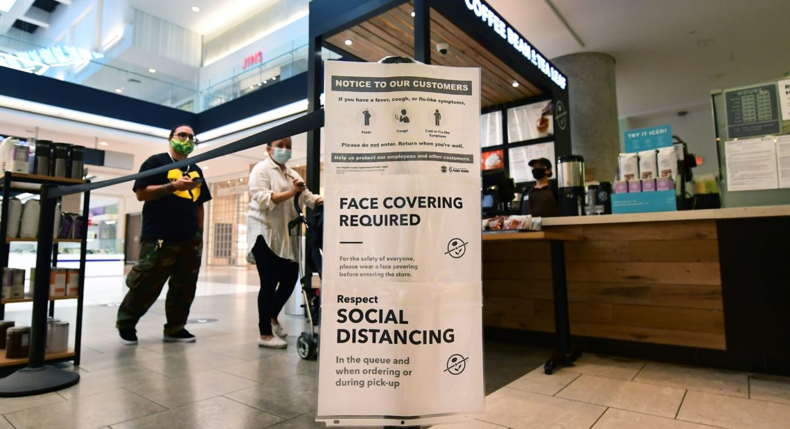 Social distancing instructions are posted at California's Westfield Santa Anita shopping mall on June 12, as local businesses enter Phase 3 reopening. Frederic J. Brown/AFP/Getty Images