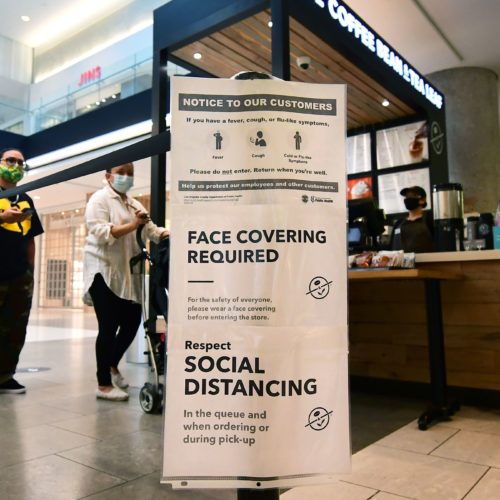 Social distancing instructions are posted at California's Westfield Santa Anita shopping mall on June 12, as local businesses enter Phase 3 reopening. Frederic J. Brown/AFP/Getty Images