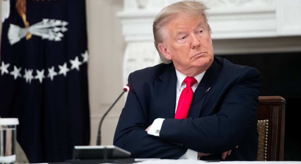 President Trump, seen here during a meeting Thursday at the White House, shared a video on Twitter with a fake CNN headline. The social media network flagged the doctored footage as "manipulated media." CREDIT: Saul Loeb/AFP via Getty Images
