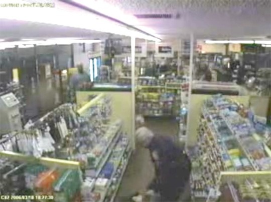 A video still from security camera footage that captured Spokane Police officer Karl Thompson beating and hogtieing Otto Zehm in 2006. Zehm died at a local hospital. Thompson was sentenced to 51 months in prison.