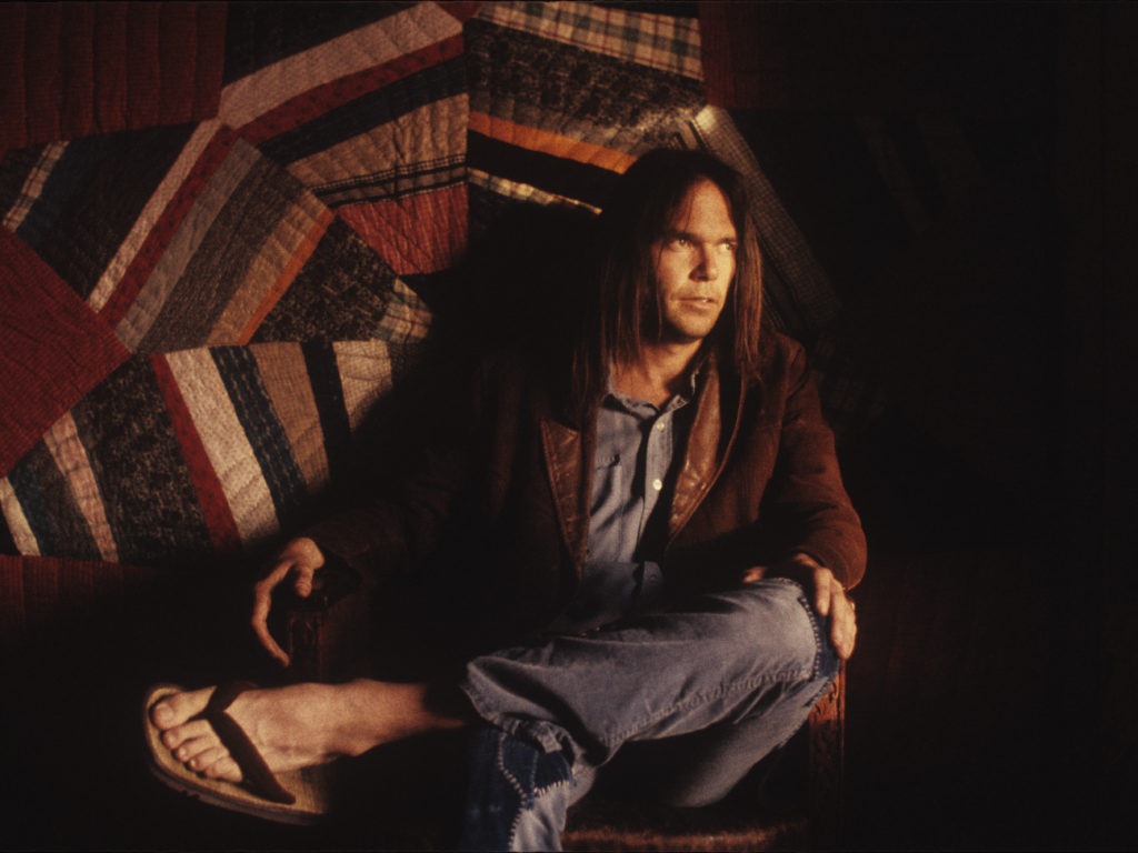 Neil Young's newly released album, Homegrown, arrives at the same moment as two other veteran songwriters, Bob Dylan and Willie Nelson, put out projects of their own. CREDIT: Henry Diltz/Courtesy of the artist