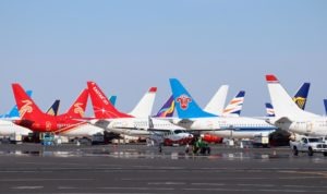 A ground crew towed the all-electric Cessna to its hangar past rows of grounded Boeing 737 Max jets at Grant County International Airport.