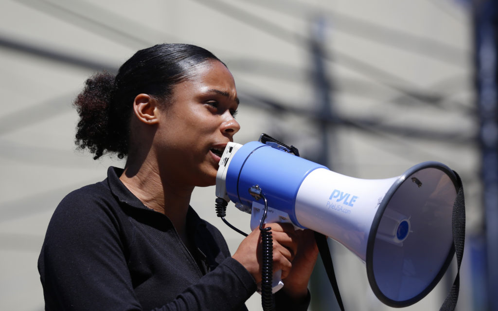 Activist Jaiden Grayson talks about her opposition to new concrete barricades that were installed by the city. CREDIT: Jim Urquhart for NPR