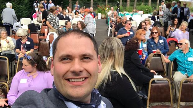 Washington gubernatorial candidate Anton Sakharov takes a selfie on July 9, 2020, at a forum held outside Camas.