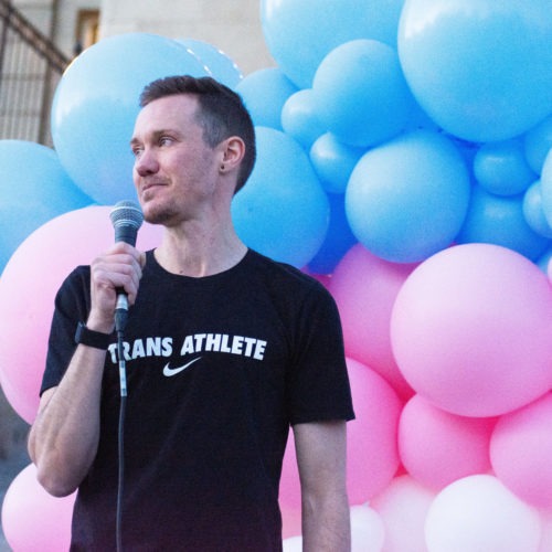 Chris Mosier, the first known transgender person to qualify for an Olympic trial, joined protesters in Boise, Idaho, to push back against legislation targeting transgender residents. CREDIT: James Dawson/Boise State Public Radio