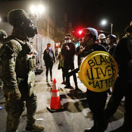 Federal law enforcement agents confront protesters in Portland, Ore., on Sunday, July 26, 2020. Spencer Platt/Getty Images