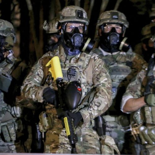 Federal officers deployed tear gas and fired less-lethal rounds into a crowd of protesters late Thursday, July 16, 2020. The actions came just hours after the head of the Department of Homeland Security called the protesters “violent anarchists.” CREDIT: Beth Nakamura/The Oregonian via AP