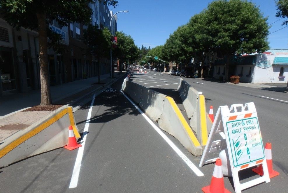 Despite being a college town, home to WSU's main campus, Pullman's downtown core is largely made for cars to drive through. A test over this summer added a protected bike lane and angle parking to make it more walkable.