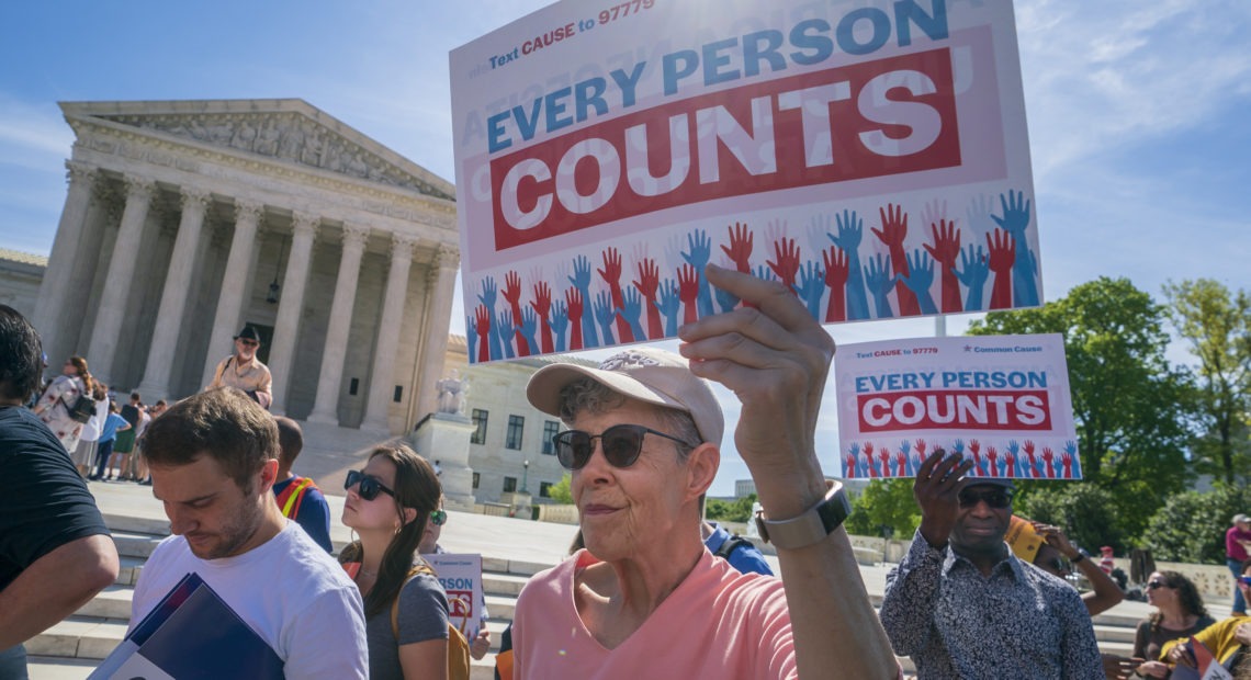 Demonstrators rally outside the U.S. Supreme Court in April 2019 to protest against the Trump administration's efforts to add the now-blocked citizenship question to the 2020 census. CREDIT: J. Scott Applewhite/AP