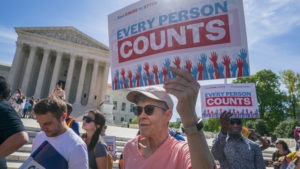 Demonstrators rally outside the U.S. Supreme Court in April 2019 to protest against the Trump administration's efforts to add the now-blocked citizenship question to the 2020 census. CREDIT: J. Scott Applewhite/AP