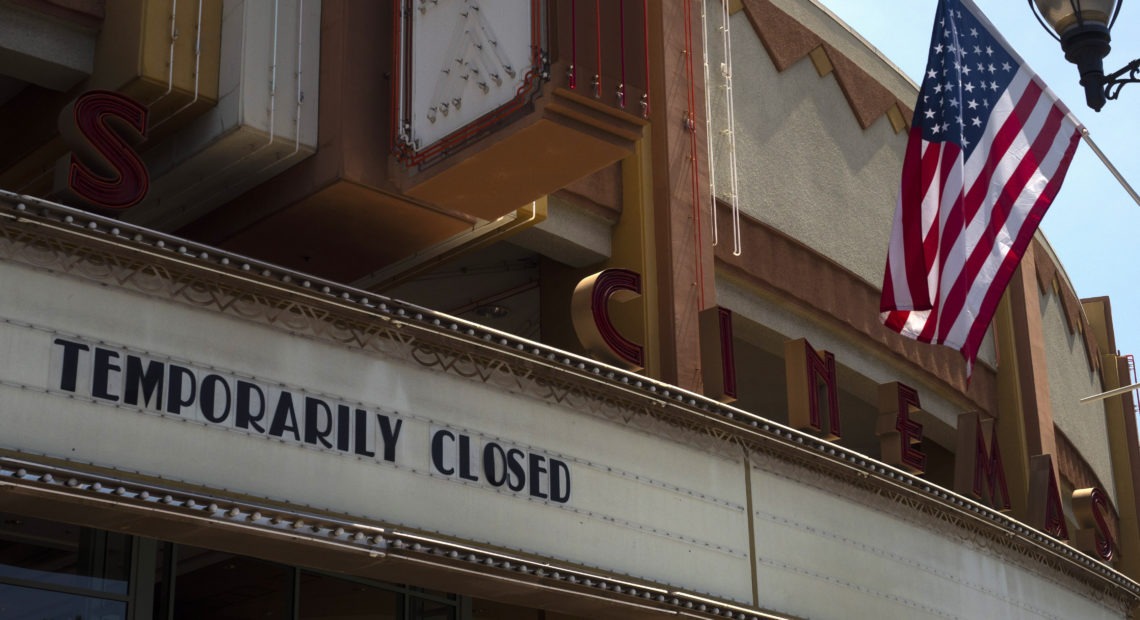 A movie theater is seen closed due to the coronavirus pandemic on July 2, 2020, in Brea, Calif. The U.S. economy shrank at a record 32.9% rate in the second quarter as the pandemic cost tens of millions of jobs. CREDIT: Jae C. Hong/AP