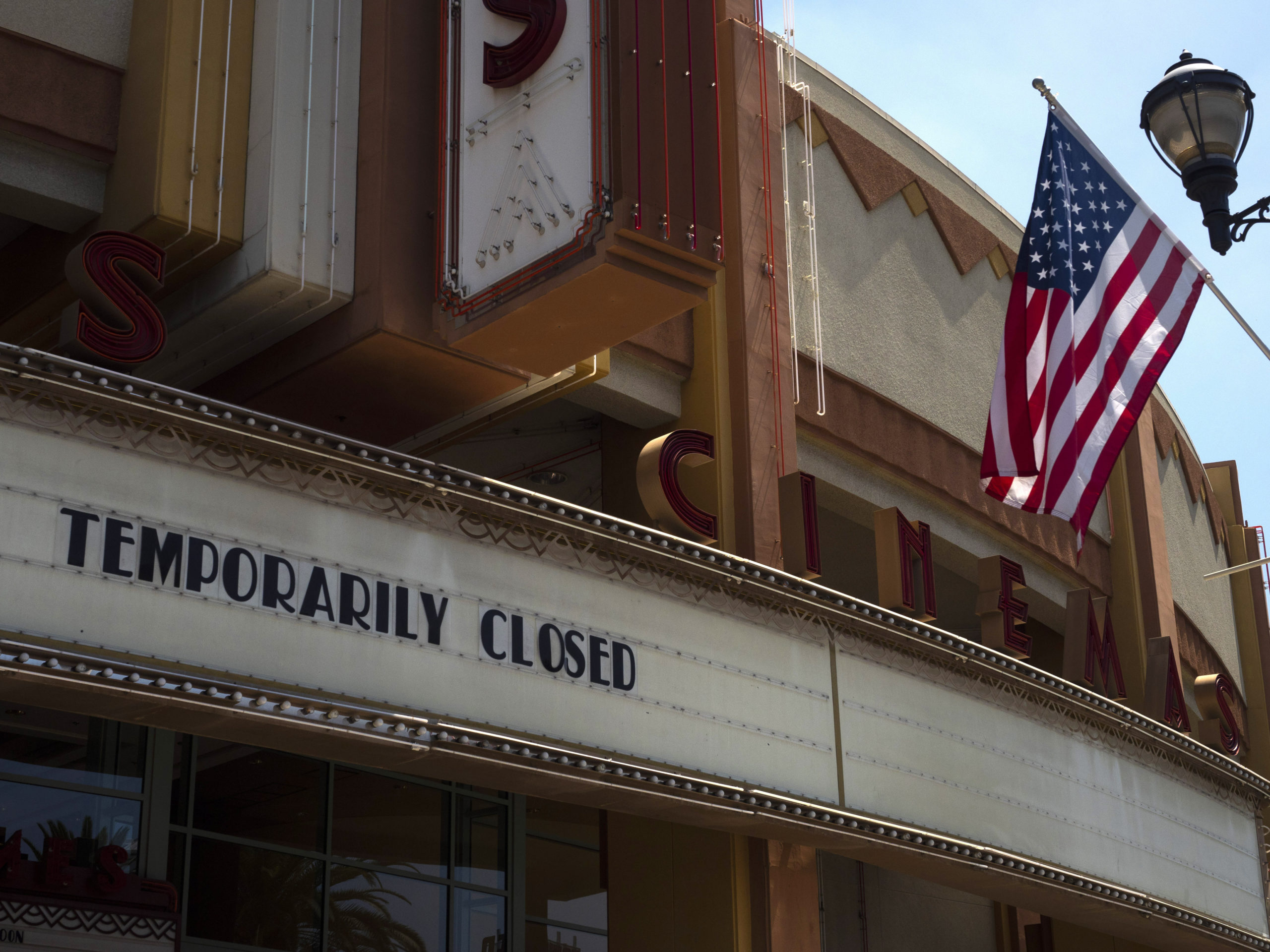 A movie theater is seen closed due to the coronavirus pandemic on July 2, 2020, in Brea, Calif. The U.S. economy shrank at a record 32.9% rate in the second quarter as the pandemic cost tens of millions of jobs. CREDIT: Jae C. Hong/AP