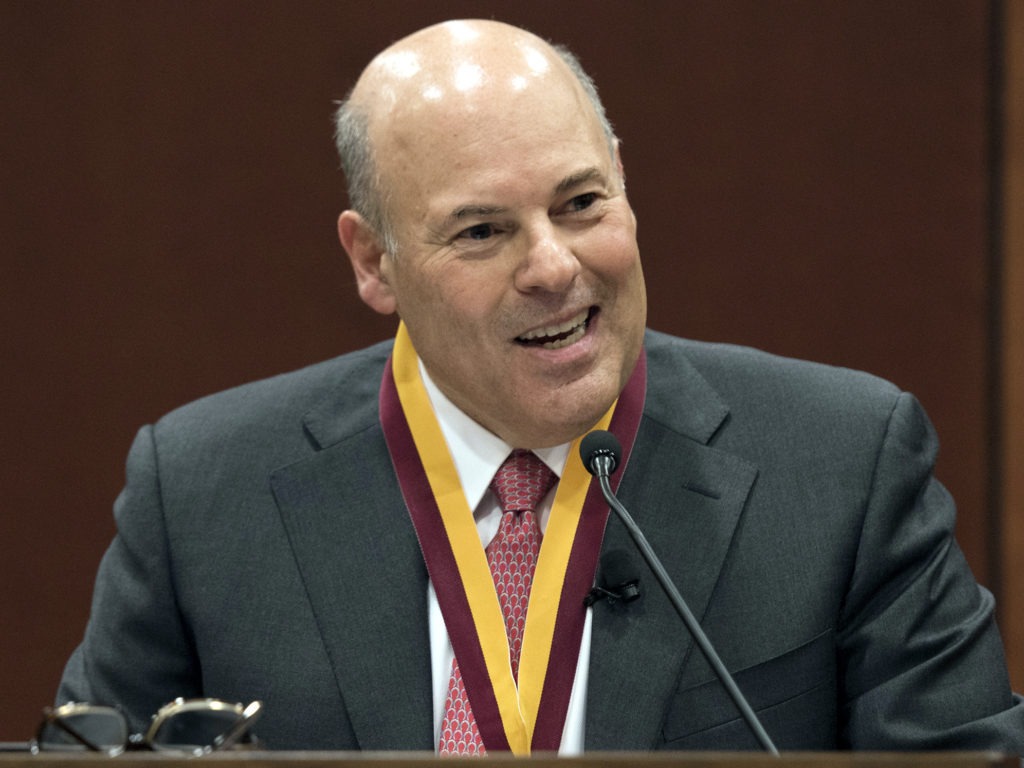 In this March 1, 2017, file photo, Elon Trustee Louis DeJoy is honored with Elon's Medal for Entrepreneurial Leadership in Elon. N.C. Now postmaster general, DeJoy's plans are controversial. CREDIT: Kim Walker/AP