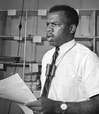 Civil rights leader John Lewis speaks during a news conference in Jackson, Miss., on June 23, 1964. CREDIT: Jim Bourdier/AP