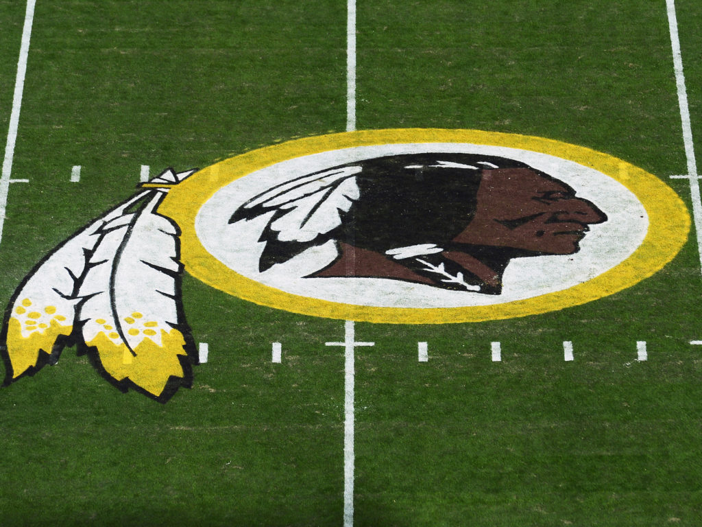 A view of the Washington NFL team's logo at center field before a game between the Detroit Lions at FedExField on November 2019 in Landover, Maryland. Patrick CREDIT: McDermott/Getty Images