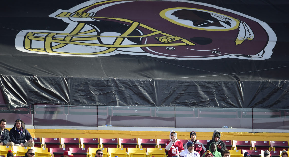 Fans sit in the stands before the start of a game between the New York Giants and Washington Redskins at FedEx Field in 2019 in Landover, Md. The Redskins, and other teams, are reviewing their names. CREDIT: Patrick McDermott/Getty Images
