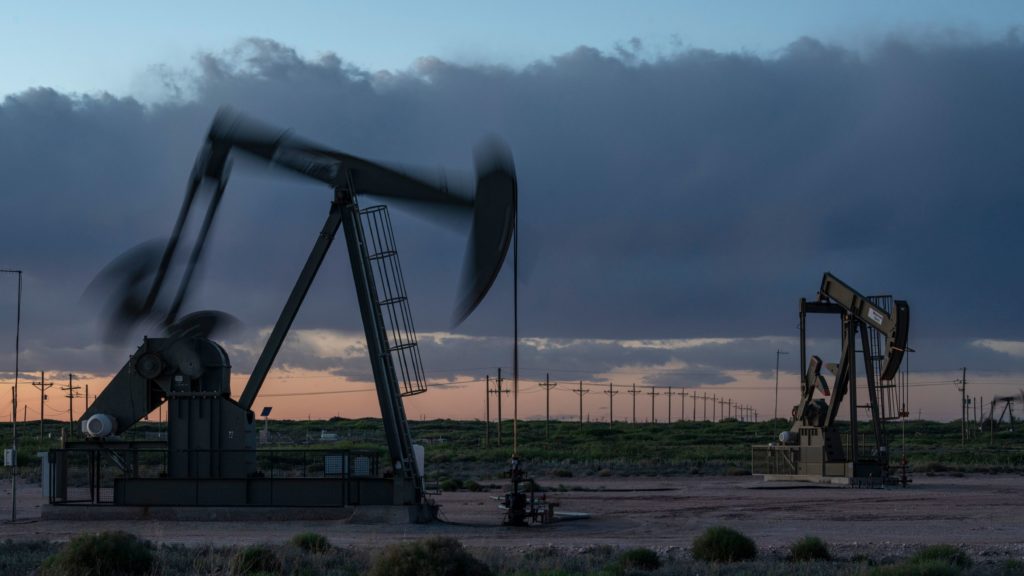 Pump jacks operate at dusk near Loco Hills in Eddy County, New Mexico, on April 23. U.S. oil producers are grappling with prolonged low oil prices and the uncertainty created by the coronavirus pandemic. CREDIT: Paul Ratje/AFP via Getty Images