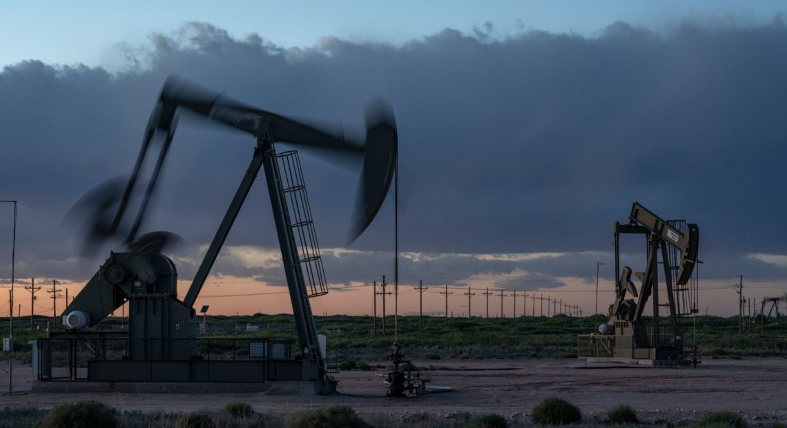 Pump jacks operate at dusk near Loco Hills in Eddy County, New Mexico, on April 23. U.S. oil producers are grappling with prolonged low oil prices and the uncertainty created by the coronavirus pandemic. CREDIT: Paul Ratje/AFP via Getty Images