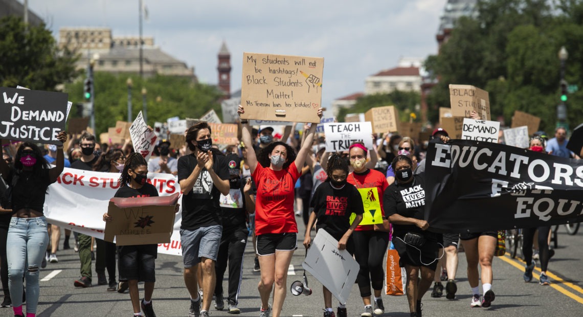 Black Students Matter demonstrators march en route to a rally at the Department of Education in Washington, D.C., on June 19. CREDIT: Tom Williams/CQ-Roll Call via Getty Images