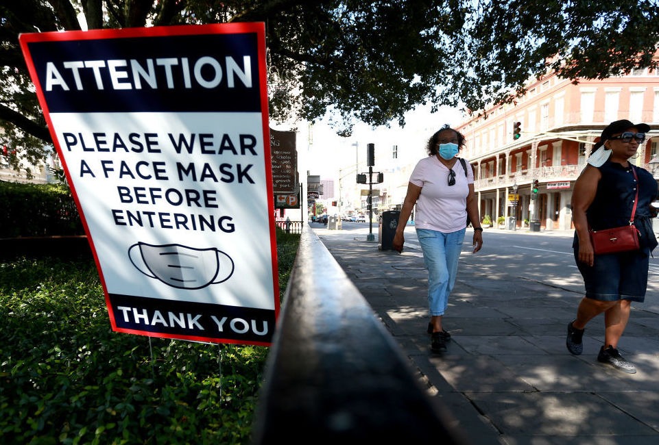 Scientists estimate that near-universal mask use could make a major difference in bringing down coronavirus infections in the United States. Sean Gardner/Getty Images