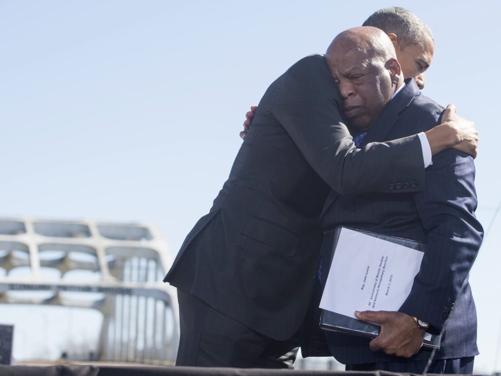 Then-President Barack Obama hugs Rep. John Lewis during a 2015 event at the Edmund Pettus Bridge in Selma, Ala., commemorating Bloody Sunday. CREDIT: Saul Loeb/AFP via Getty Images