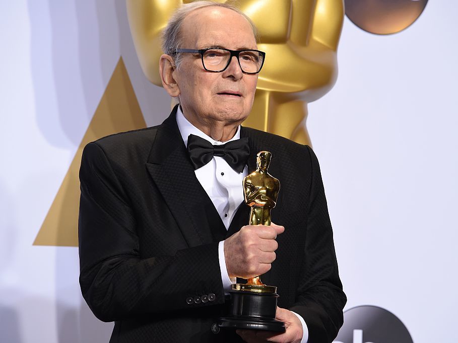 Composer Ennio Morricone, posing with his Oscar for The Hateful Eight in 2016. He died Monday at age 91 in Rome. Robyn Beck/AFP/Getty Images