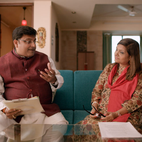 Sima Taparia (right) is a jet-setting matchmaker from Mumbai. Here she confers with astrologer Pundit Sushil ji, who helps her come up with prospective mates for her clients. Netflix