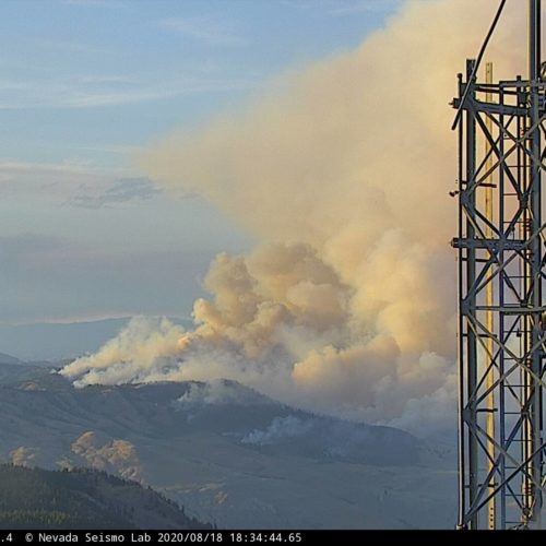 The Palmer Fire in Okanogan County, southwest of Oroville, seen from the Aeneas Mountain Lookout Tuesday evening, Aug. 18, 2020. Smoke from a fire in nearby British Columbia is also visible.