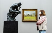 A visitor looks at Rodin's The Thinker at Alte Nationalgalerie in Berlin in May 2020. CREDIT: John Macdougall/AFP via Getty Images