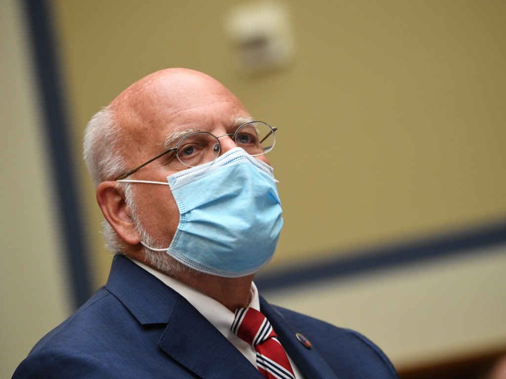 Robert Redfield, director of the Centers for Disease Control and Prevention, is calling on Americans to do their part to contain the coronavirus as flu season comes into view. Kevin Dietsch/Pool/AFP via Getty Images